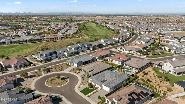 a view of a house with backyard porch and sitting area