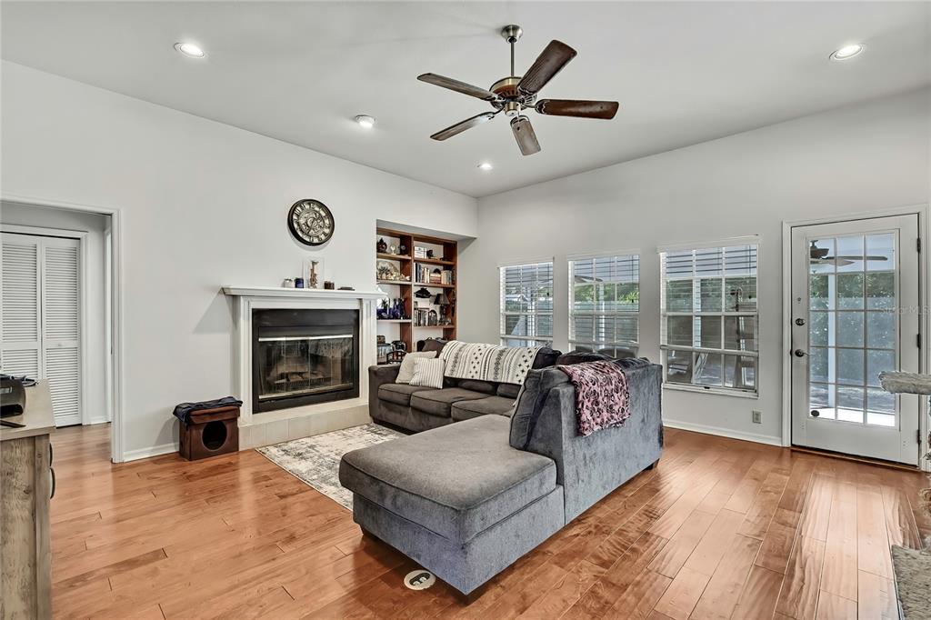 83 Greentree Street Homosassa, FL 34446 - Photo 15 of 49 a living room with furniture fireplace and window