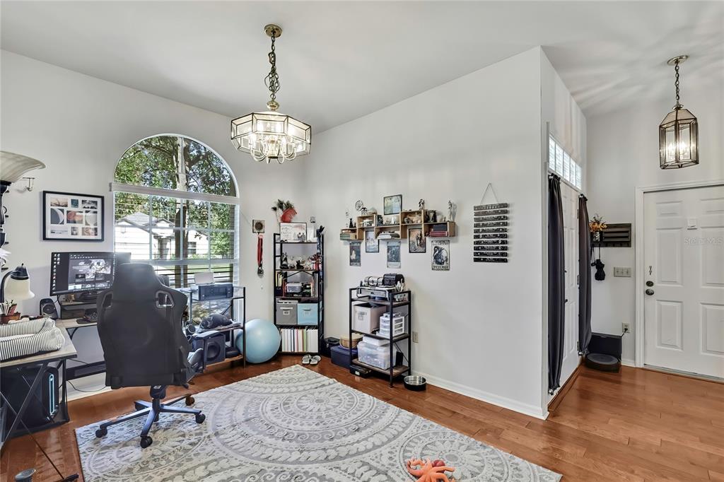 83 Greentree Street Homosassa, FL 34446 - Photo 19 of 49 a view of a room with workspace window and wooden floor