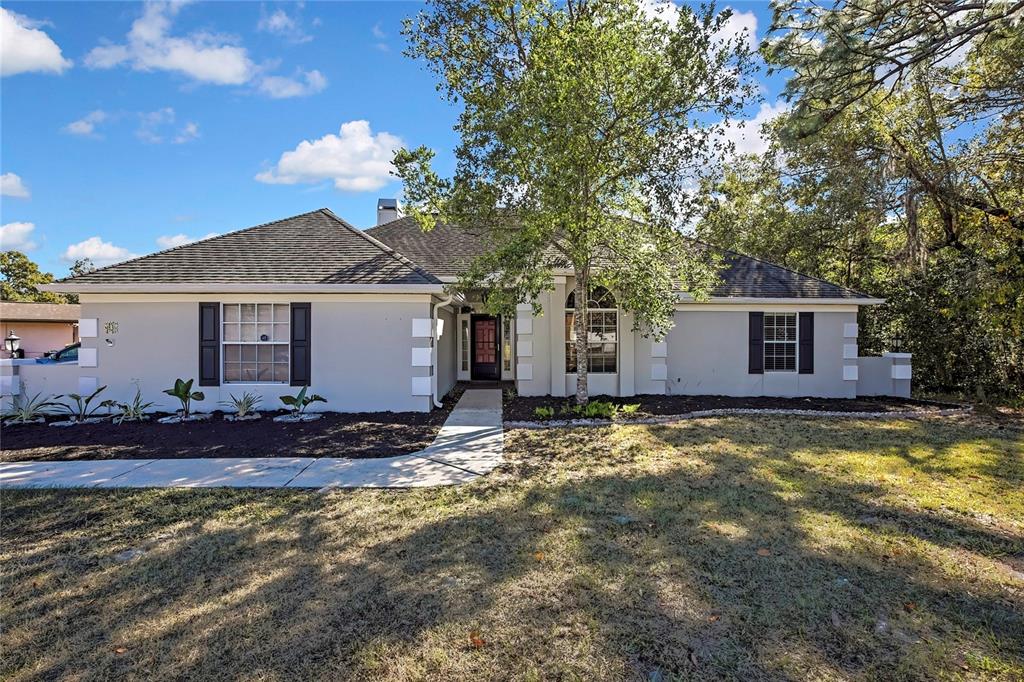 83 Greentree Street Homosassa, FL 34446 - Photo 2 of 49 a view of a house with a yard
