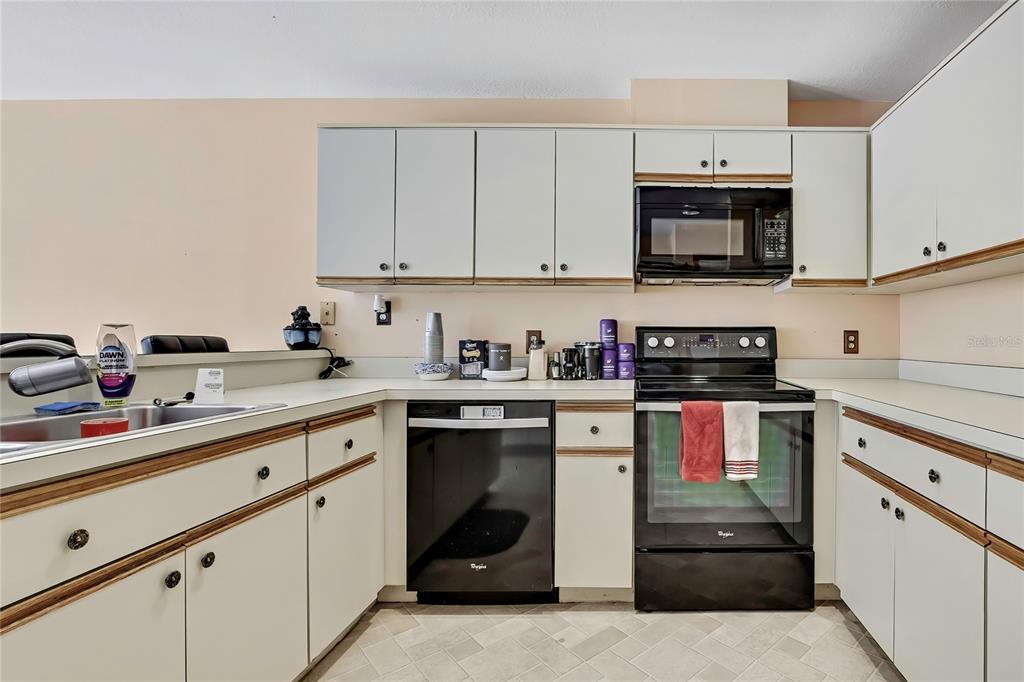 83 Greentree Street Homosassa, FL 34446 - Photo 21 of 49 a kitchen with stainless steel appliances granite countertop a sink and a stove