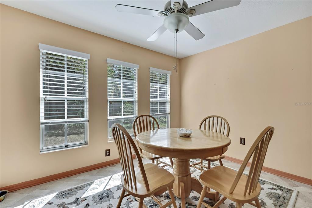 83 Greentree Street Homosassa, FL 34446 - Photo 25 of 49 a view of a dining room with furniture window and wooden floor