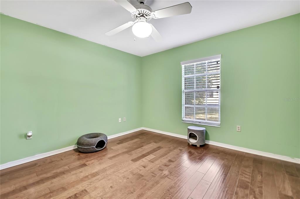 83 Greentree Street Homosassa, FL 34446 - Photo 29 of 49 a room with a window and a ceiling fan