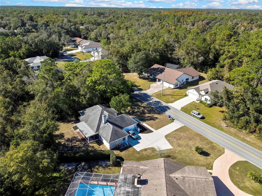 83 Greentree Street Homosassa, FL 34446 - Photo 46 of 49 an aerial view of residential houses with outdoor space