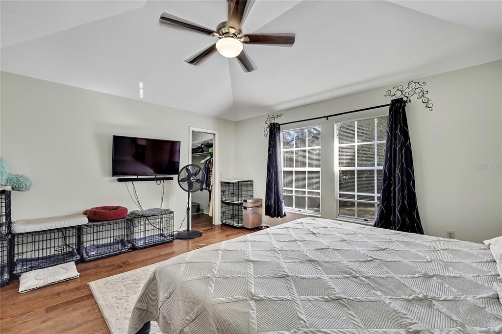 83 Greentree Street Homosassa, FL 34446 - Photo 8 of 49 a bedroom with a bed and a flat screen tv