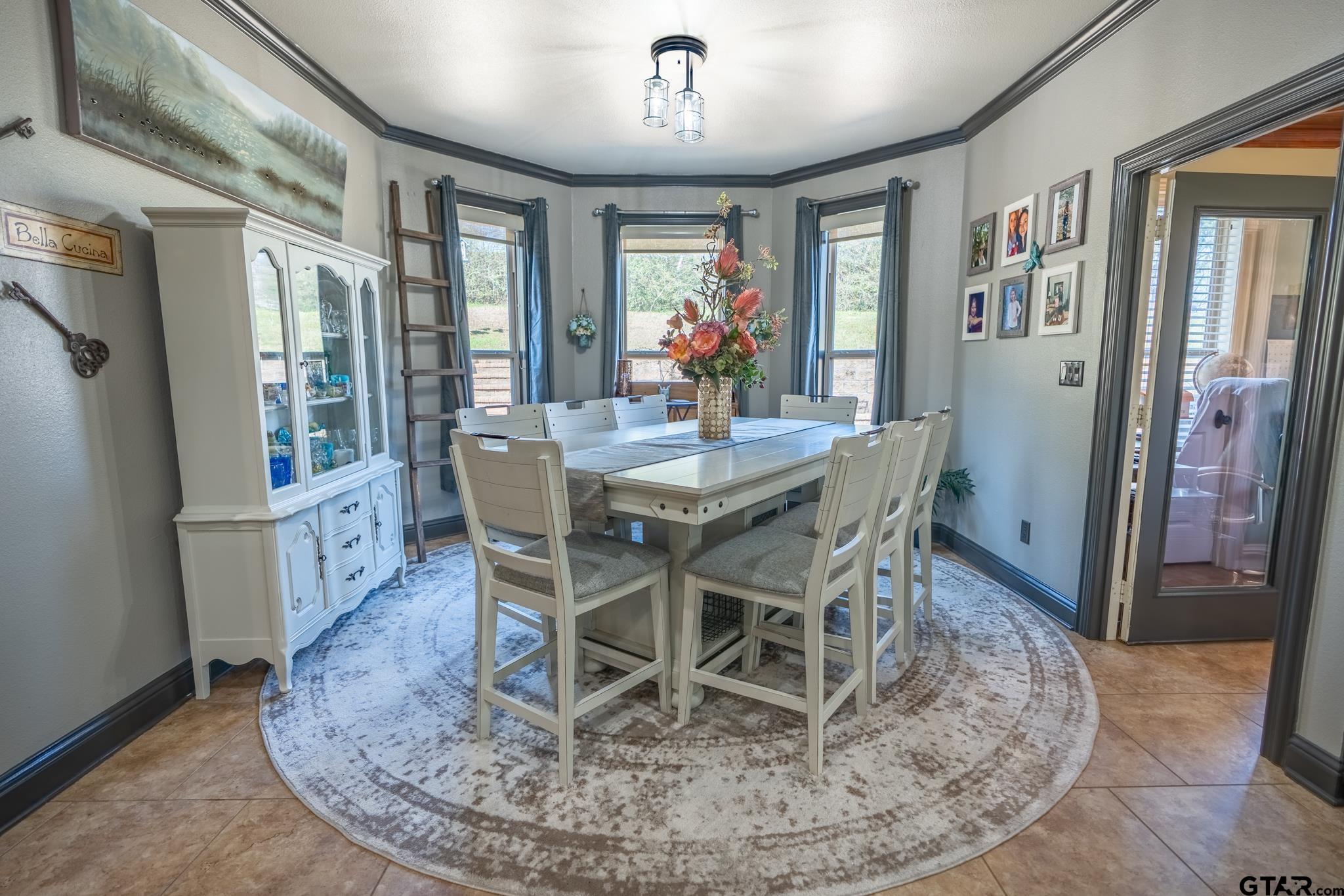 13307 Dustin Road Troup, TX 75789 - Photo 14 of 38 a view of a dining room with furniture wooden floor and chandelier