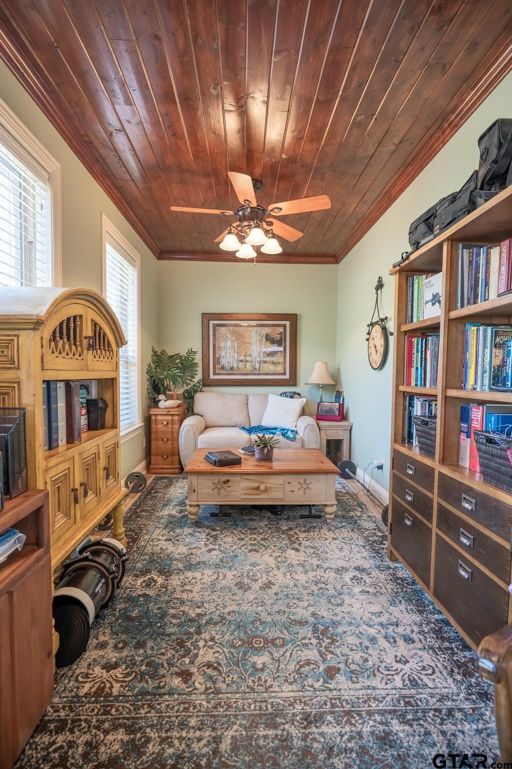 13307 Dustin Road Troup, TX 75789 - Photo 17 of 38 a living room with furniture gym equipment and a rug