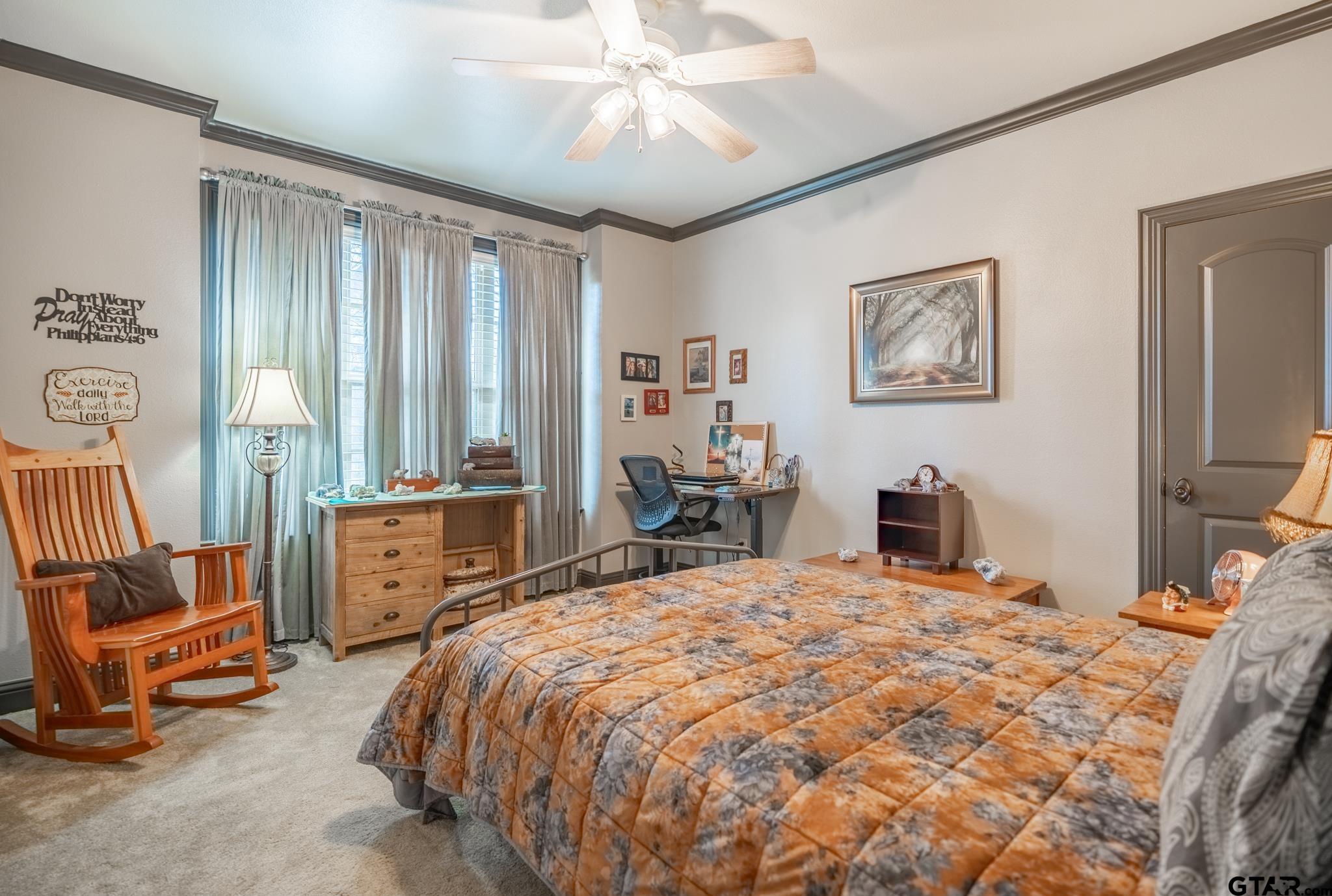 13307 Dustin Road Troup, TX 75789 - Photo 20 of 38 a bedroom with a bed a large window and furniture