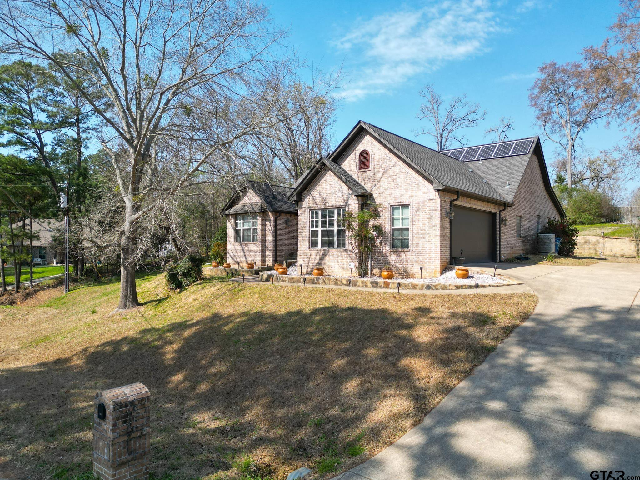 13307 Dustin Road Troup, TX 75789 - Photo 2 of 38 a view of a house with snow on the side of the road
