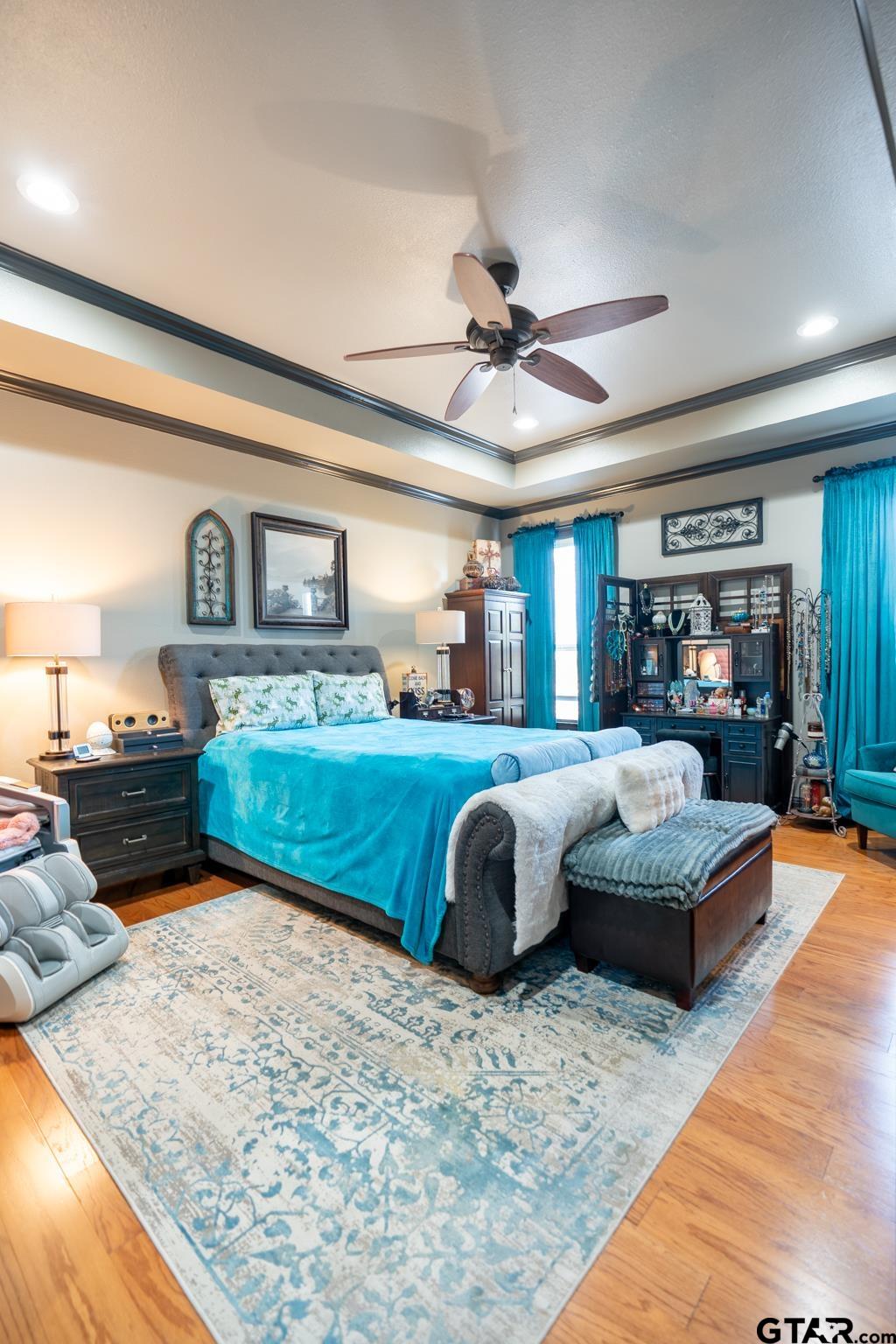 13307 Dustin Road Troup, TX 75789 - Photo 24 of 38 a bedroom with a large bed and a couch