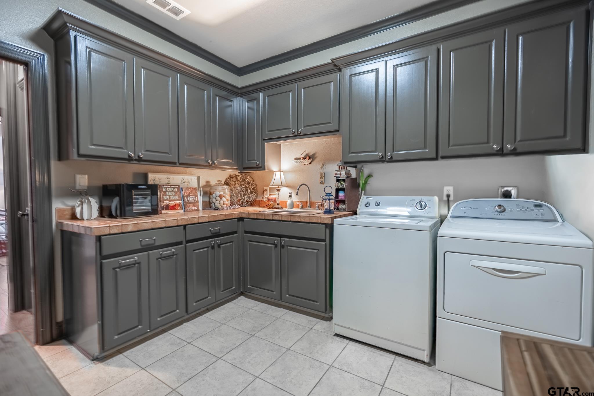 13307 Dustin Road Troup, TX 75789 - Photo 29 of 38 a kitchen with cabinets appliances and a sink