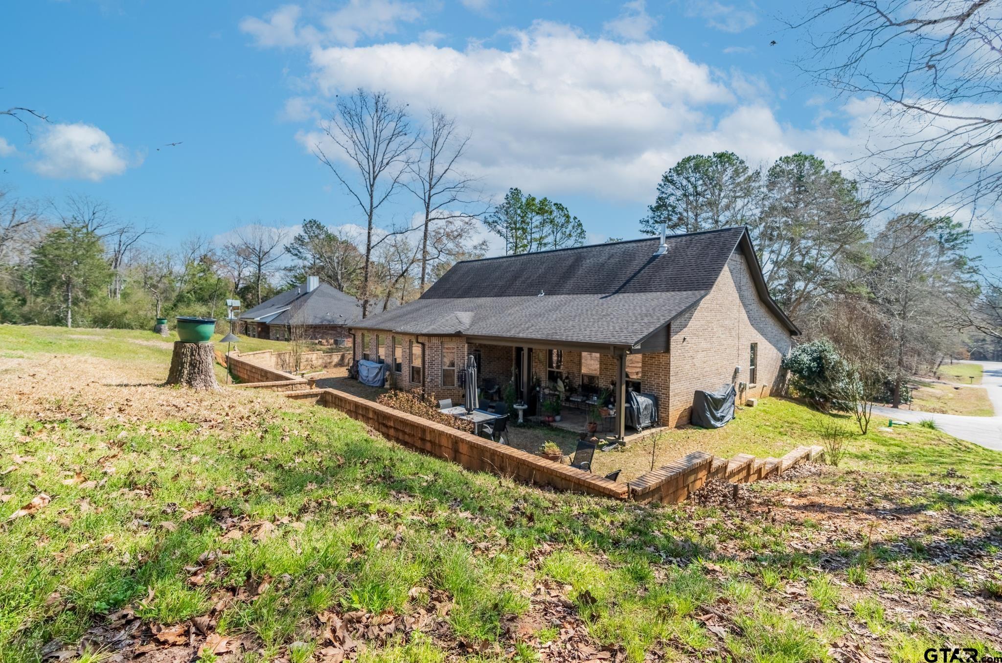 13307 Dustin Road Troup, TX 75789 - Photo 31 of 38 front view of a house with a yard