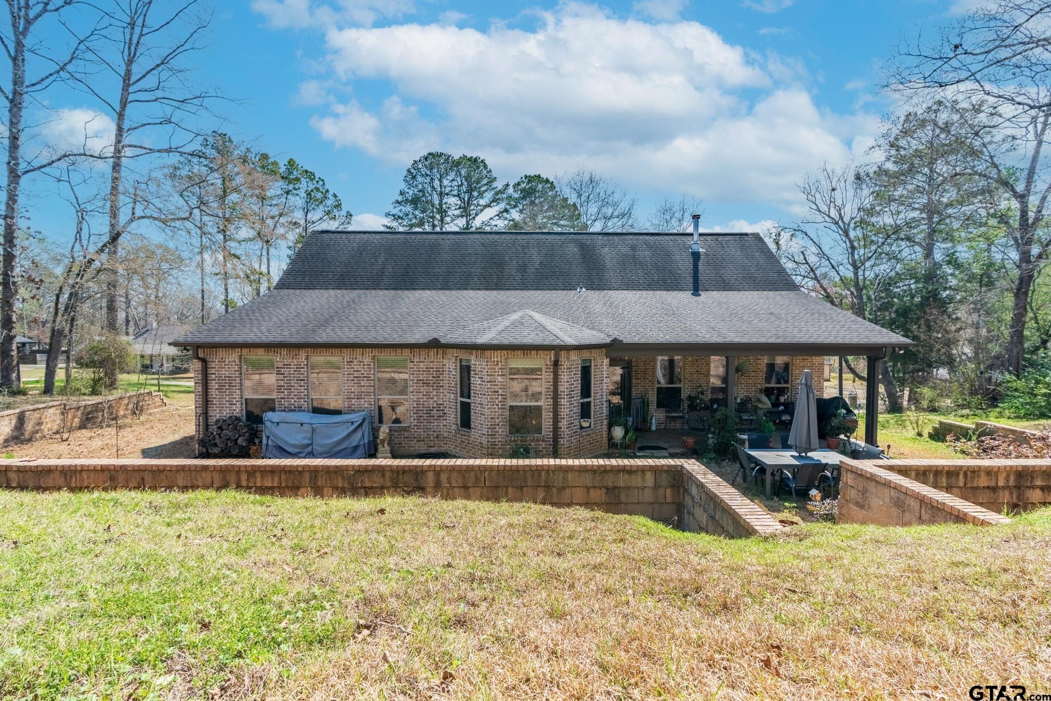 13307 Dustin Road Troup, TX 75789 - Photo 32 of 38 a view of a house with swimming pool and sitting area