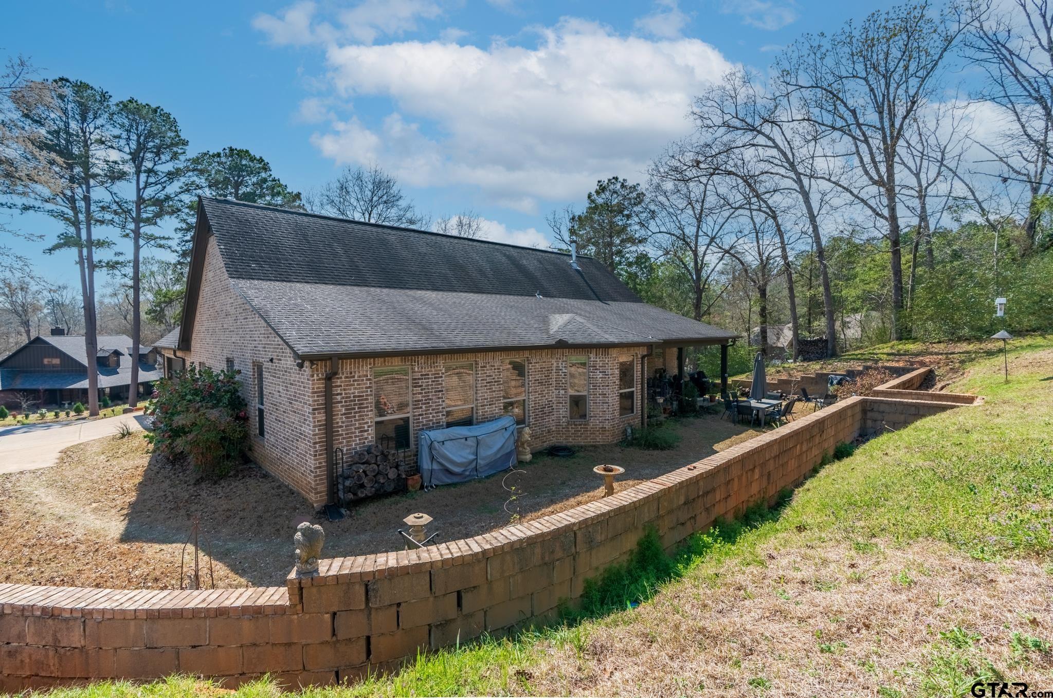 13307 Dustin Road Troup, TX 75789 - Photo 33 of 38 a front view of a house with garden