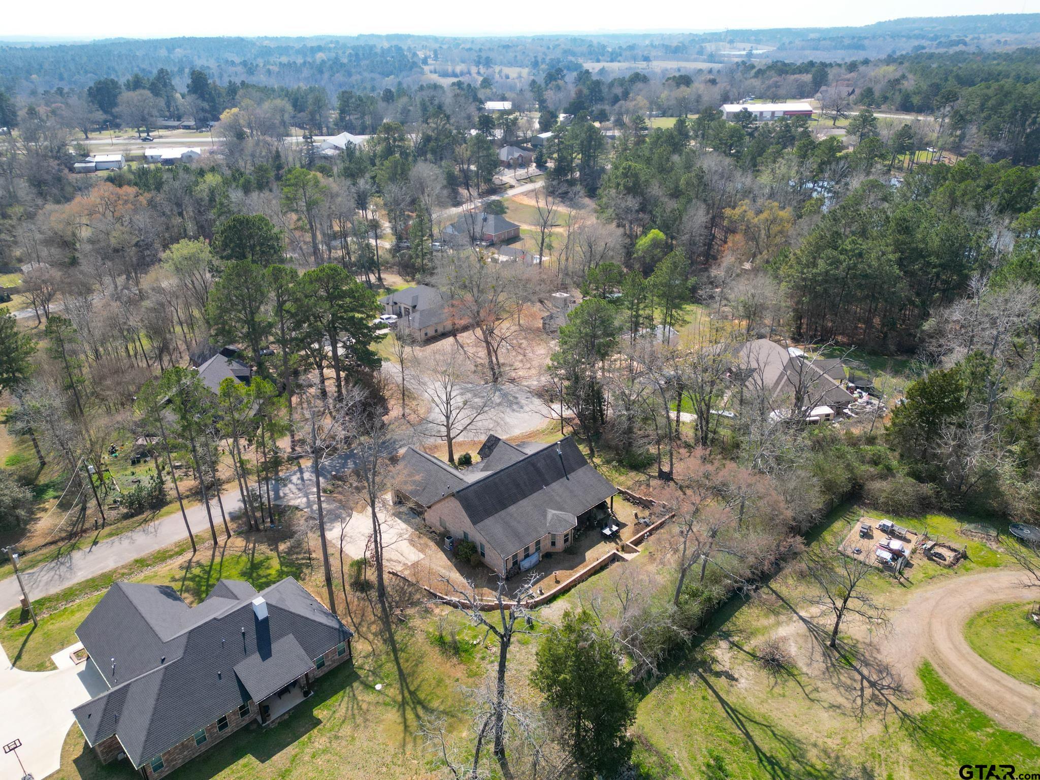 13307 Dustin Road Troup, TX 75789 - Photo 37 of 38 an aerial view of a house with a yard