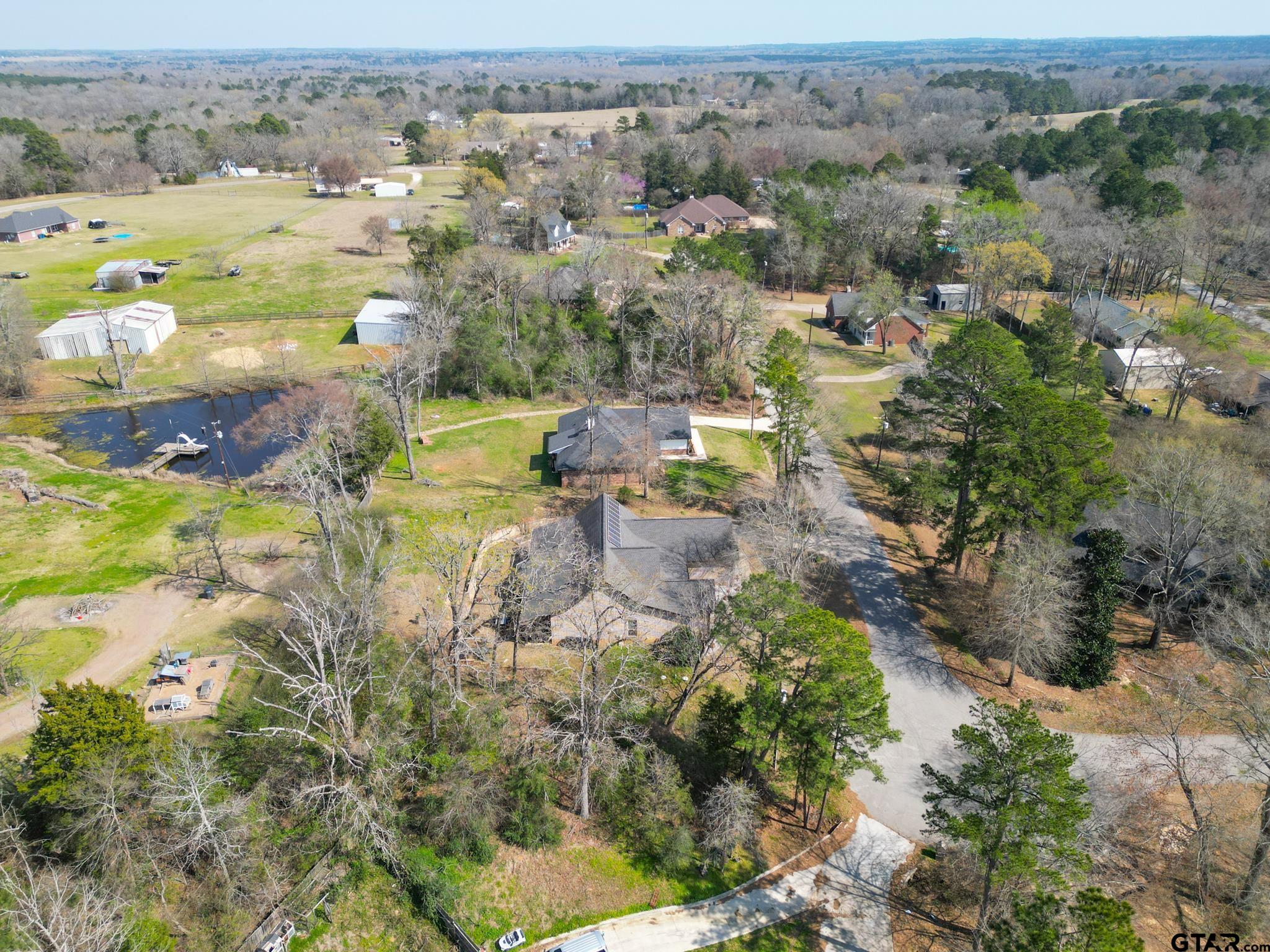 13307 Dustin Road Troup, TX 75789 - Photo 38 of 38 an aerial view of residential houses with outdoor space