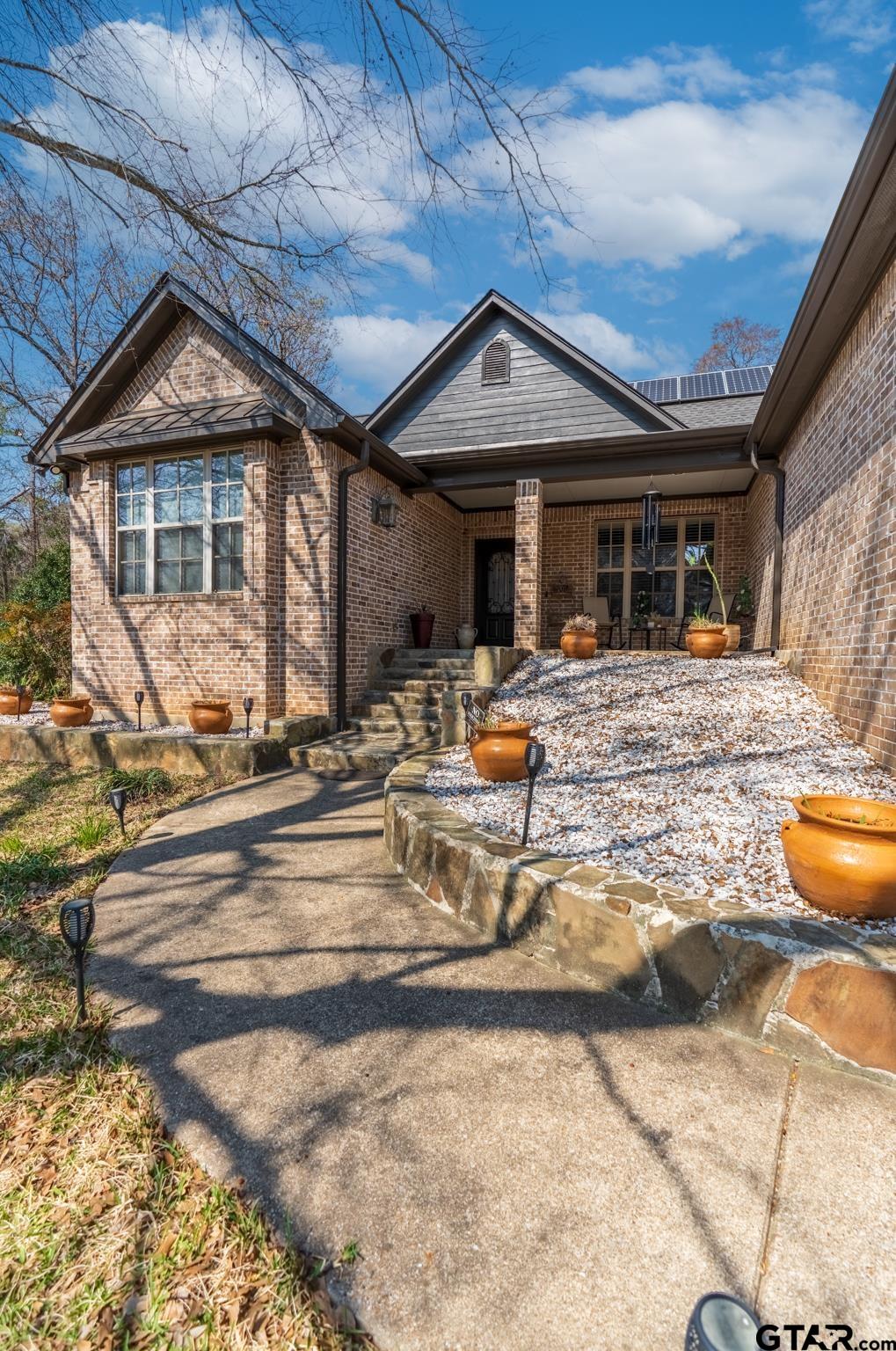 13307 Dustin Road Troup, TX 75789 - Photo 5 of 38 a view of a house with backyard outdoor seating area and furniture