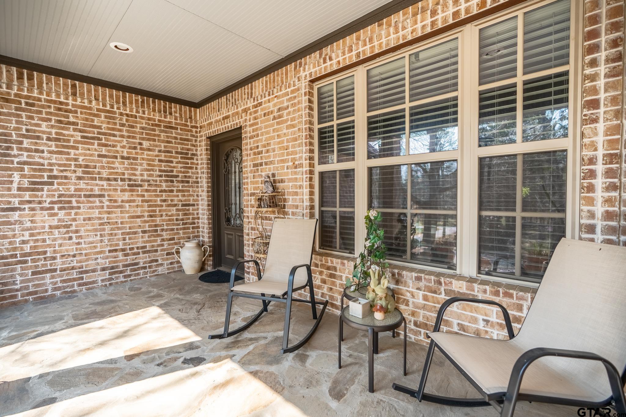 13307 Dustin Road Troup, TX 75789 - Photo 7 of 38 a view of a chair and table in the back yard