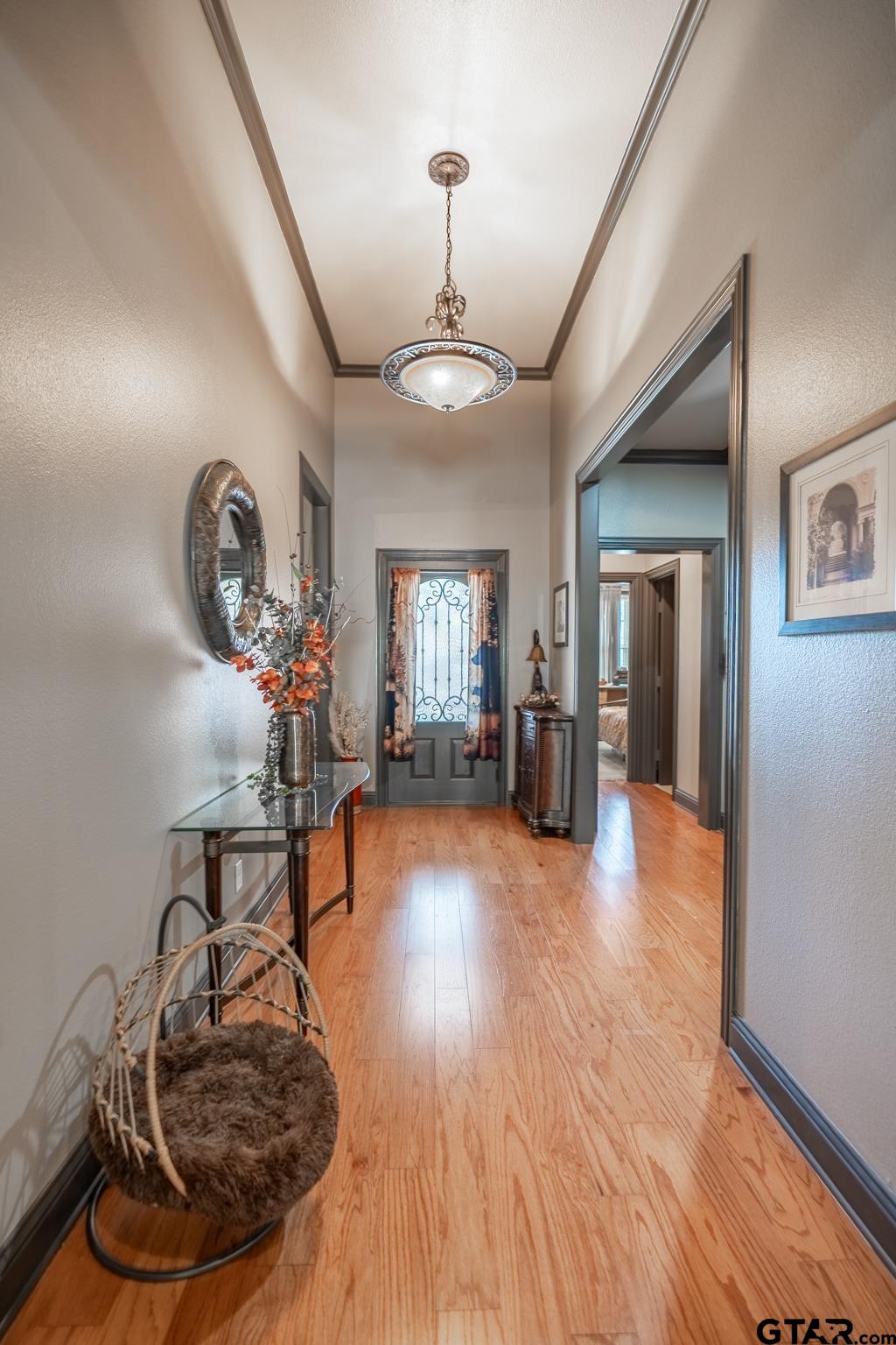 13307 Dustin Road Troup, TX 75789 - Photo 9 of 38 a living room with furniture and a chandelier