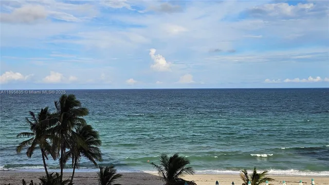 a kitchen with stainless steel appliances granite countertop a sink a refrigerator and a refrigerator