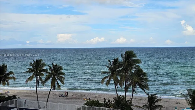 a bedroom with a bed and wall painting