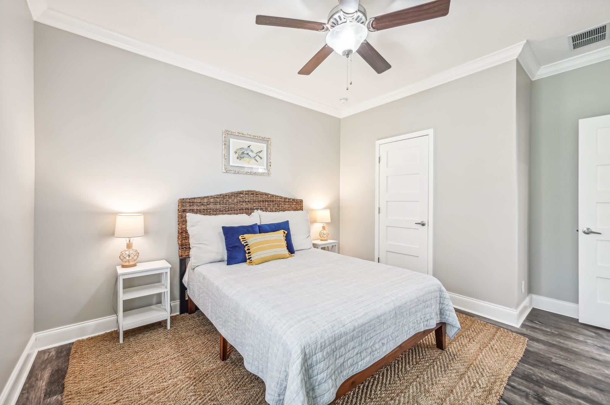 4954 A1A South St. Augustine, FL 32080 - Photo 25 of 42 a bedroom with a bed and a chandelier