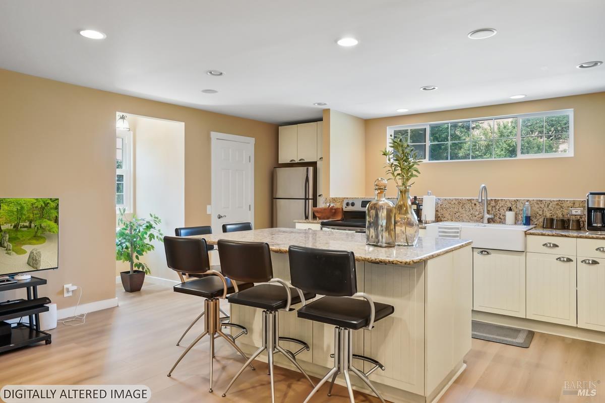 1846 Indian Valley Road, Unit A Novato, CA 94947 - Photo 26 of 45 a kitchen with a table chairs sink and cabinets