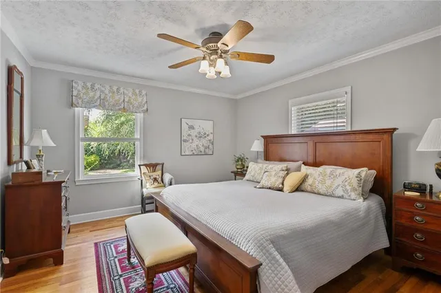 a bedroom with a bed and a table