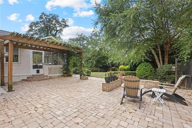 a view of a patio with a chairs and table in a patio
