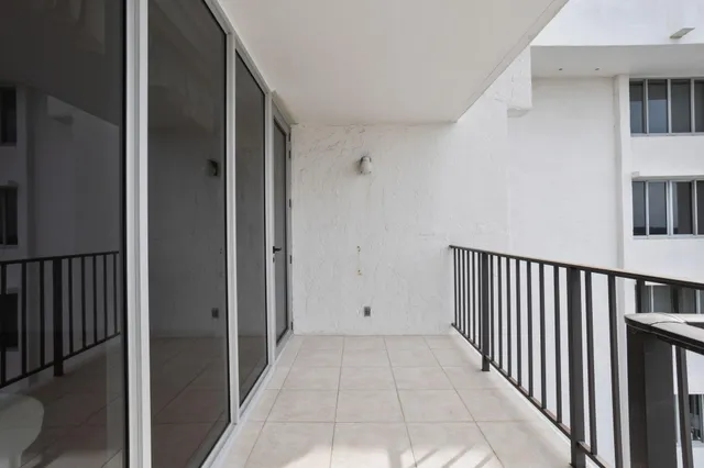 a bed room with a bed and a large window