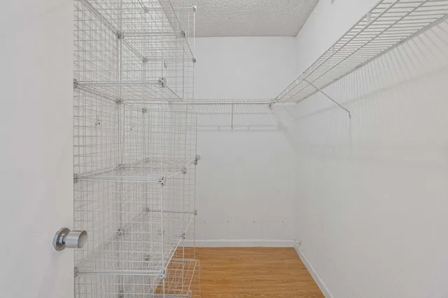 a view of a balcony with chairs and potted plants