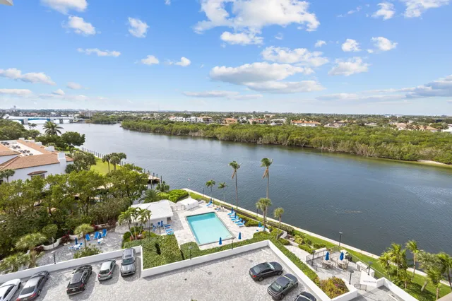 a view of a lake with a house in the background