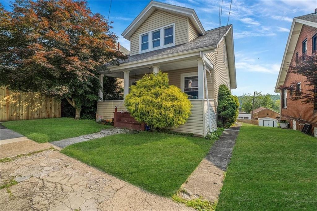 306 Meadow Avenue Charleroi, PA 15022 - Photo 1 of 36 a front view of a house with garden