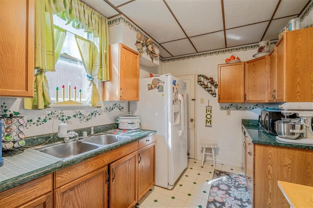 306 Meadow Avenue Charleroi, PA 15022 - Photo 15 of 36 a bathroom with a sink a mirror and a shower