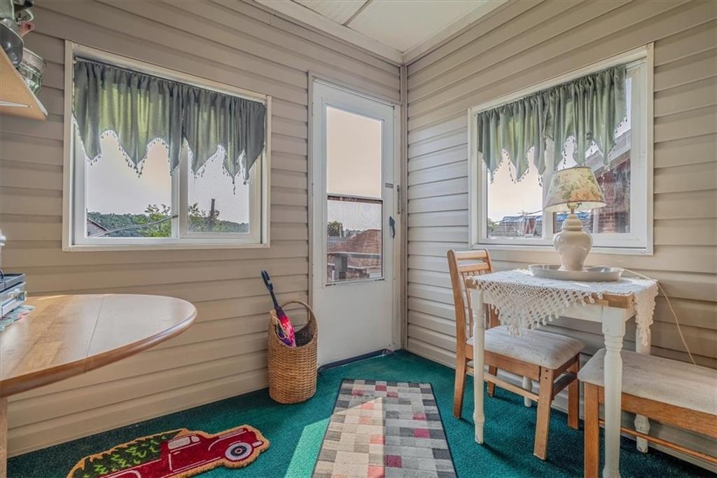 306 Meadow Avenue Charleroi, PA 15022 - Photo 16 of 36 a bathroom with a sink a mirror and a window