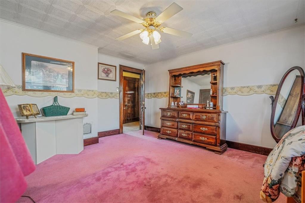 306 Meadow Avenue Charleroi, PA 15022 - Photo 24 of 36 a living room with furniture and a flat screen tv