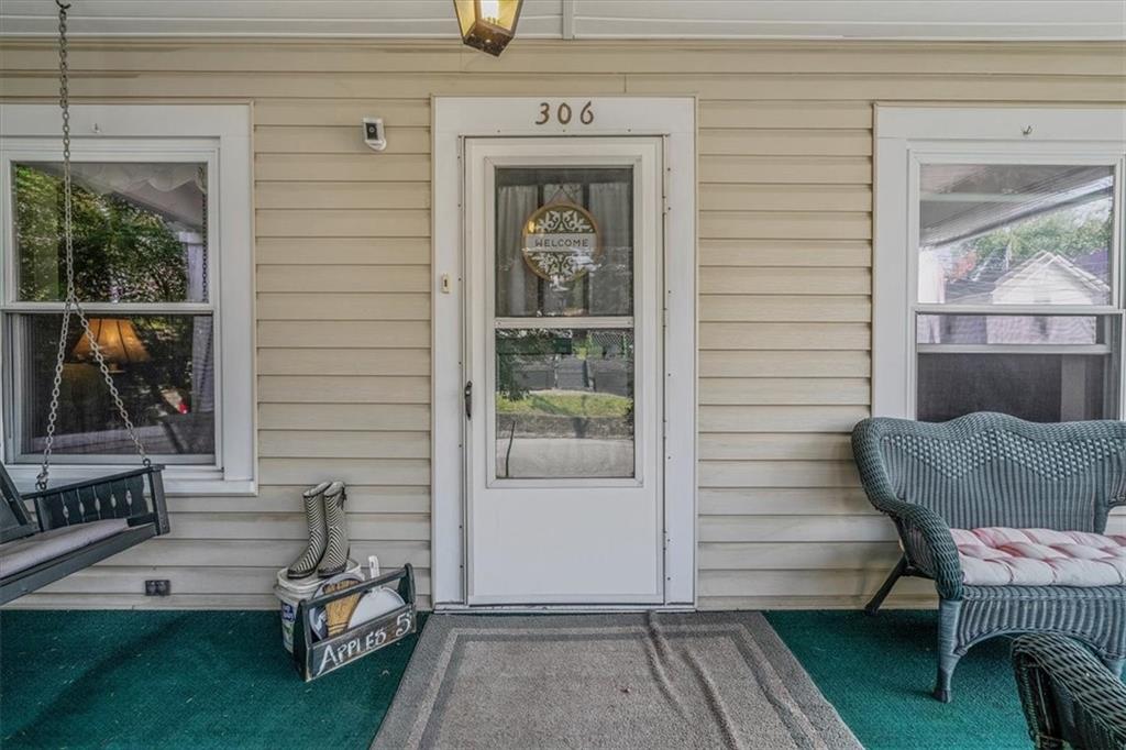 306 Meadow Avenue Charleroi, PA 15022 - Photo 3 of 36 a view of a porch with furniture and floor to ceiling window