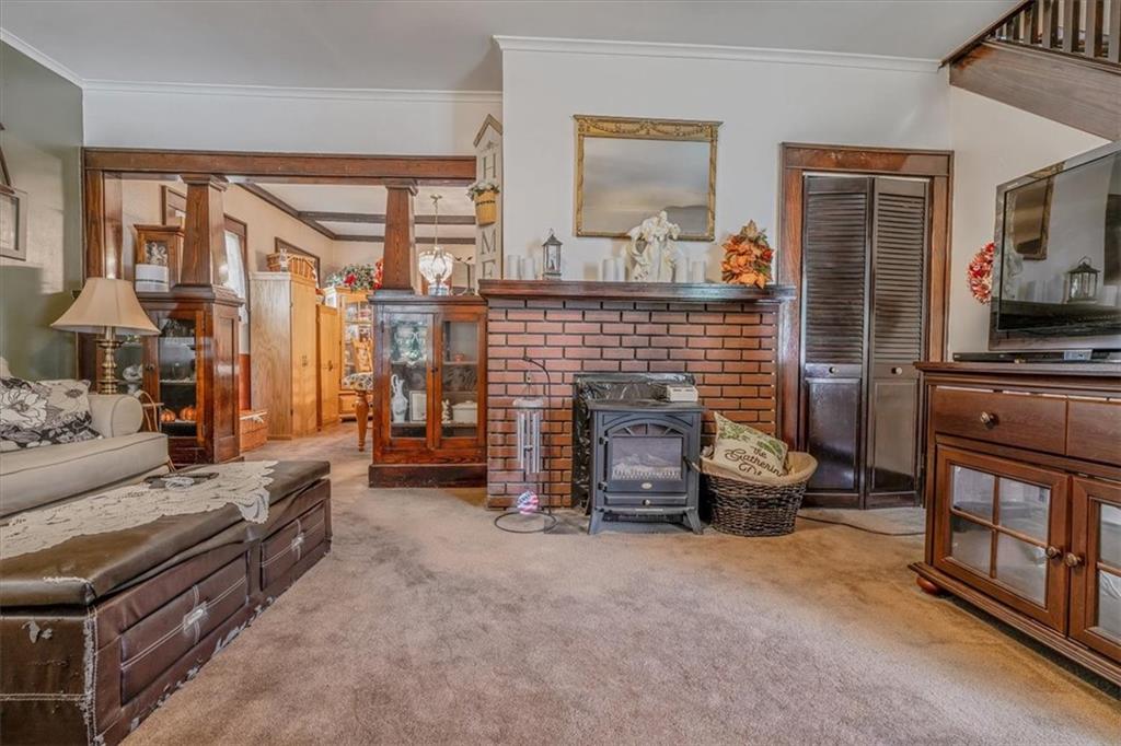306 Meadow Avenue Charleroi, PA 15022 - Photo 4 of 36 a living room with furniture and a fireplace
