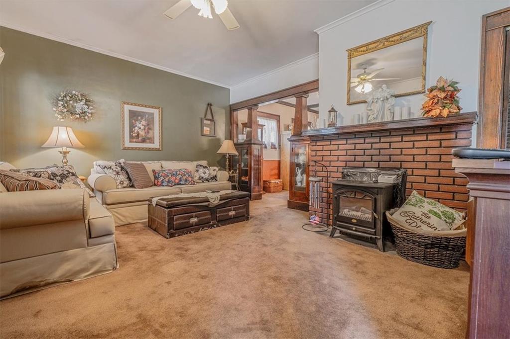 306 Meadow Avenue Charleroi, PA 15022 - Photo 5 of 36 a living room with furniture and a fireplace