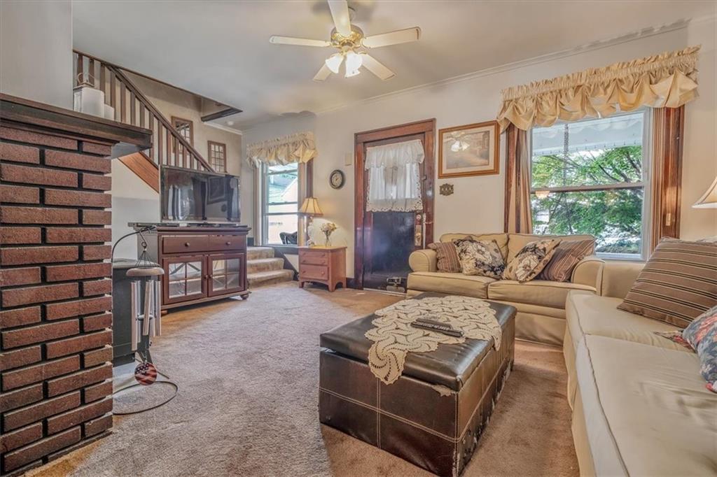 306 Meadow Avenue Charleroi, PA 15022 - Photo 6 of 36 a living room with furniture and wooden floor