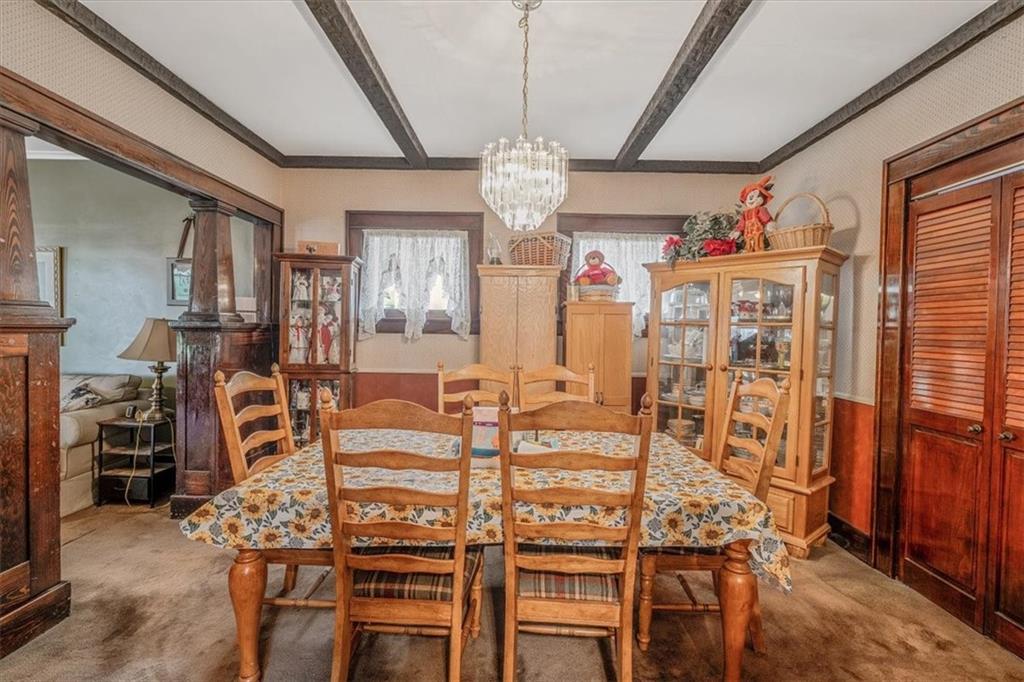 306 Meadow Avenue Charleroi, PA 15022 - Photo 9 of 36 a view of a dining room with furniture and chandelier