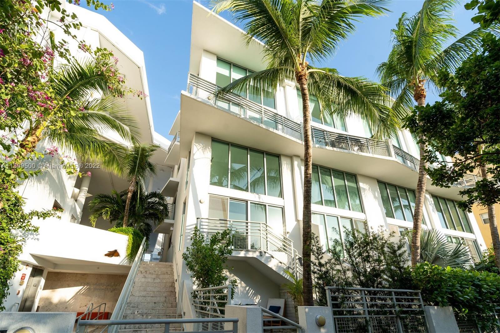 245 Michigan Avenue, Unit LG4 Miami Beach, FL 33139 - Photo 1 of 14 a view of entryway and tree