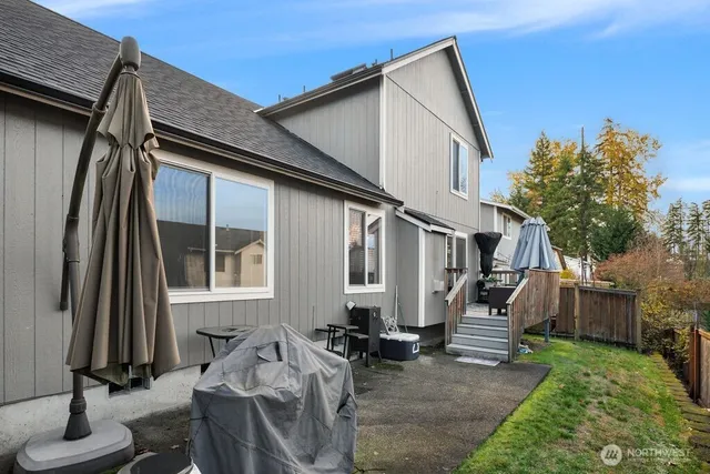 a house view with a backyard space