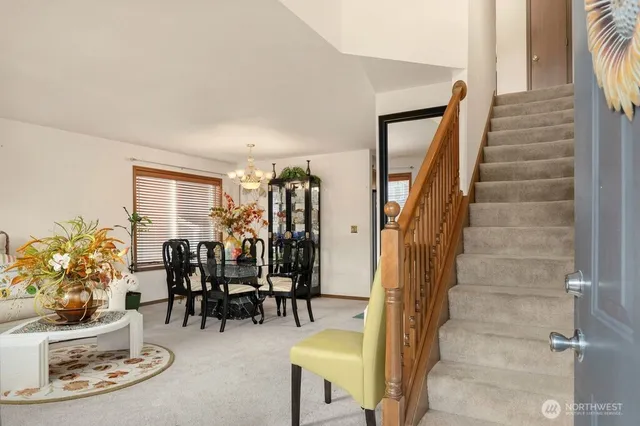 a dining room with furniture and wooden floor