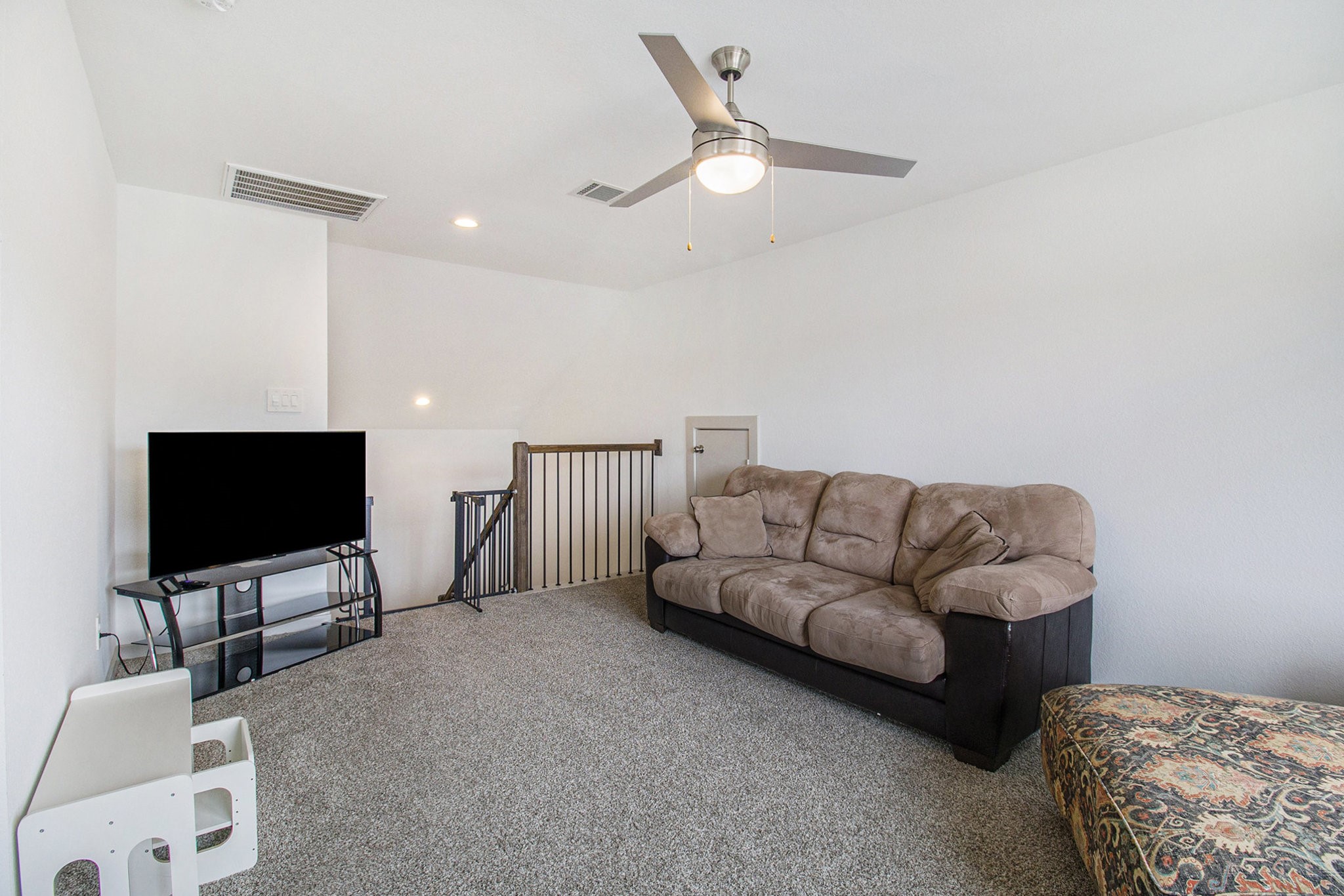 1823 William Scott Street Baytown, TX 77523 - Photo 22 of 27 a living room with furniture and a flat screen tv
