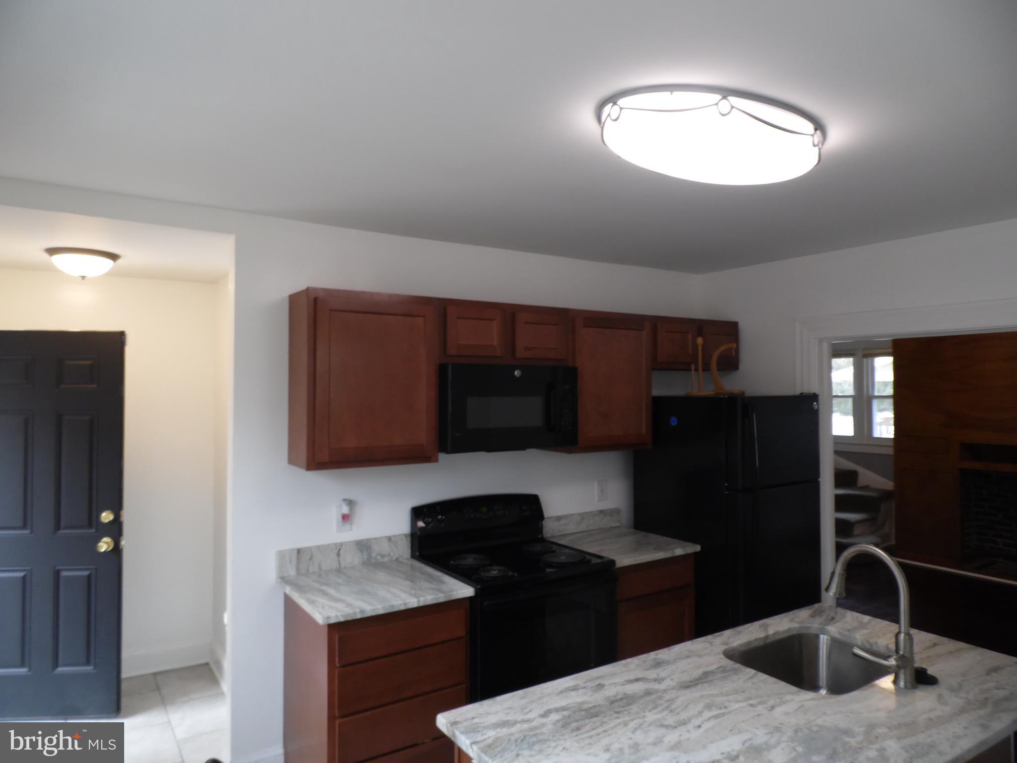 3727 Nortonia Road Baltimore, MD 21216 - Photo 6 of 21 Kitchen and door to side porch