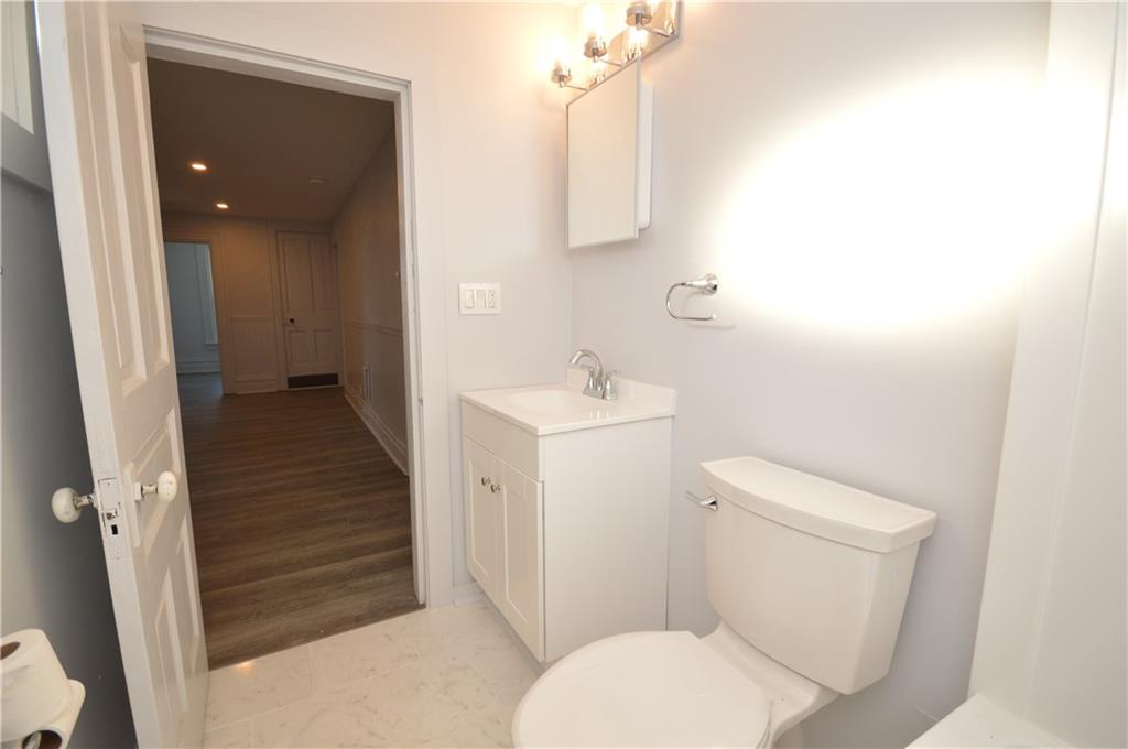 115 Meade Avenue Pittsburgh, PA 15202 - Photo 20 of 38 a white toilet sitting next to a bathroom sink