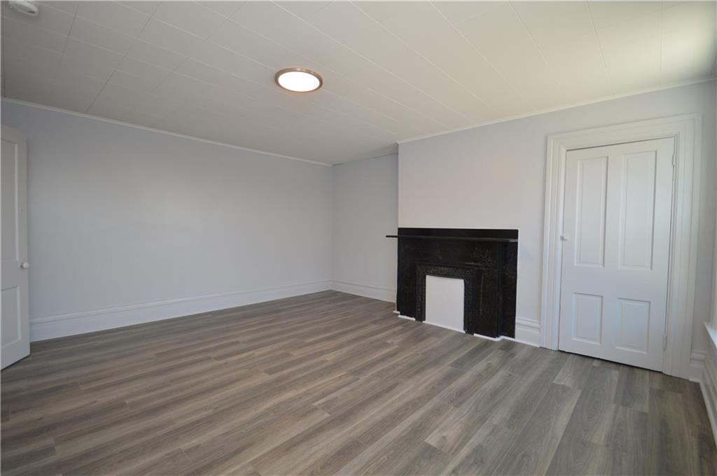 115 Meade Avenue Pittsburgh, PA 15202 - Photo 27 of 38 a view of empty room with wooden floor