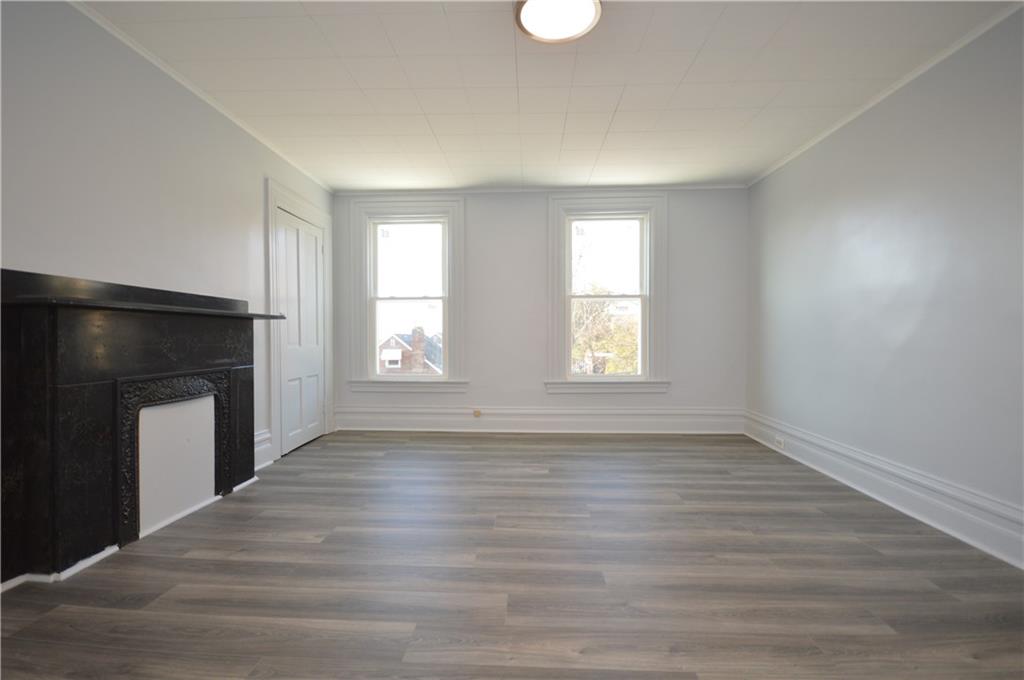 115 Meade Avenue Pittsburgh, PA 15202 - Photo 28 of 38 an empty room with windows and fireplace