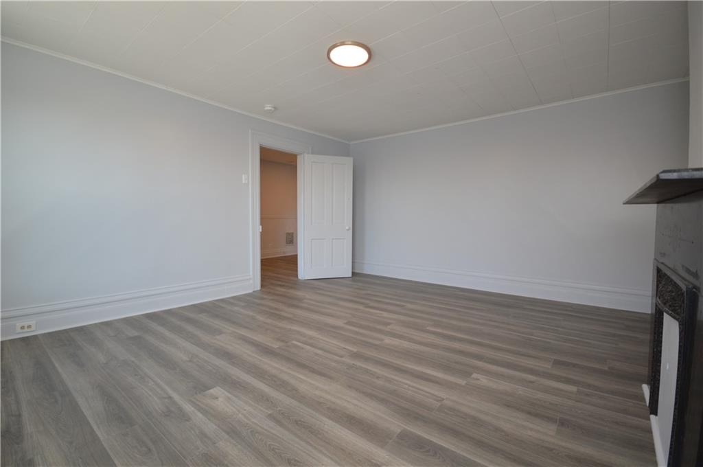 115 Meade Avenue Pittsburgh, PA 15202 - Photo 29 of 38 a view of an empty room with wooden floor
